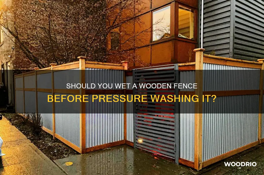do you wet a wooden fence before pressure washing it