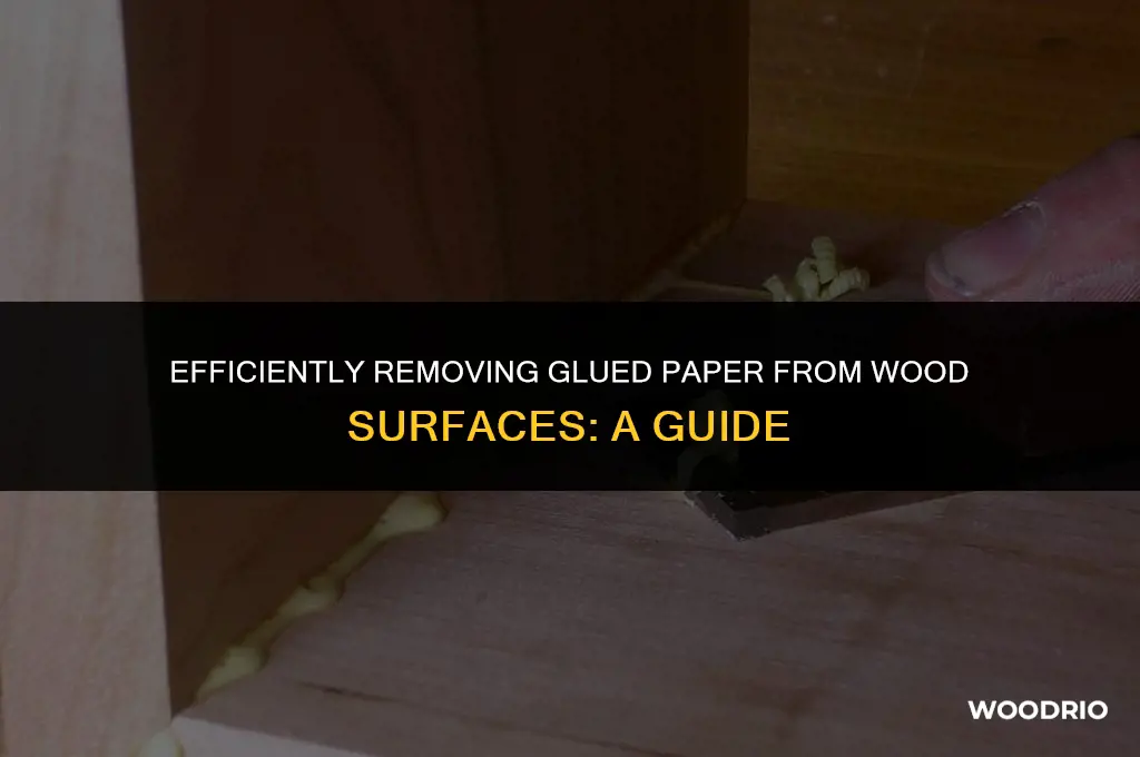 how do i remove glued paper from wood