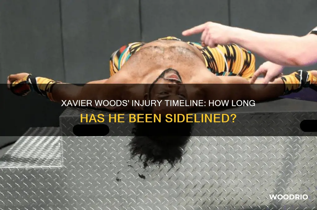 how long has xavier woods been out