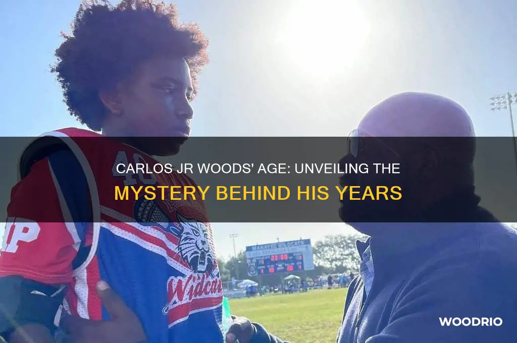 how old is carlos jr woods