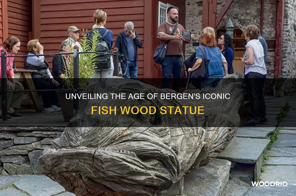 how old is the fish wood statue in bergen norway