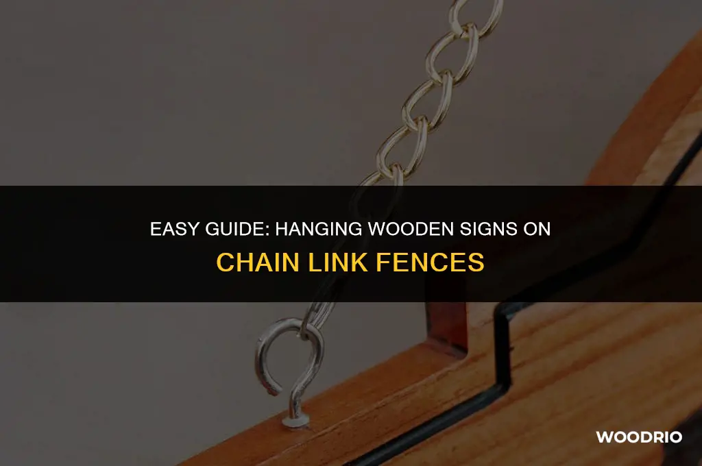 how to hang wooden signs on chain link fence