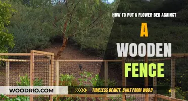 Elevate Your Garden: Creating a Stunning Flower Bed Against a Wooden Fence