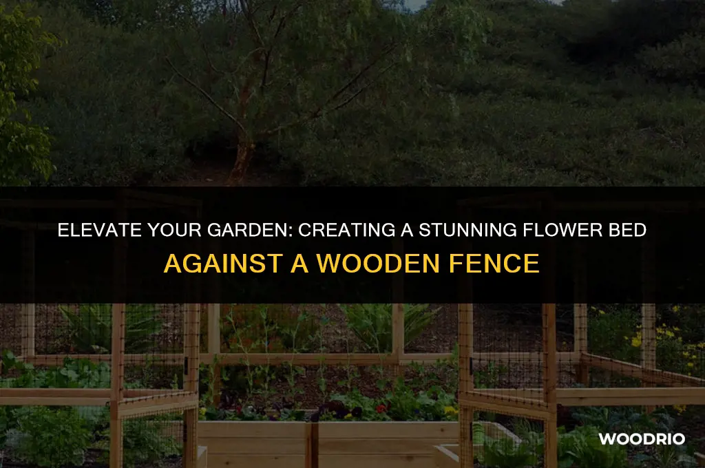 how to put a flower bed against a wooden fence