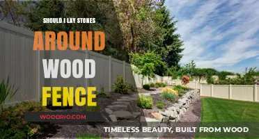 Enhancing Your Wood Fence: The Benefits and Drawbacks of Laying Stones Around It